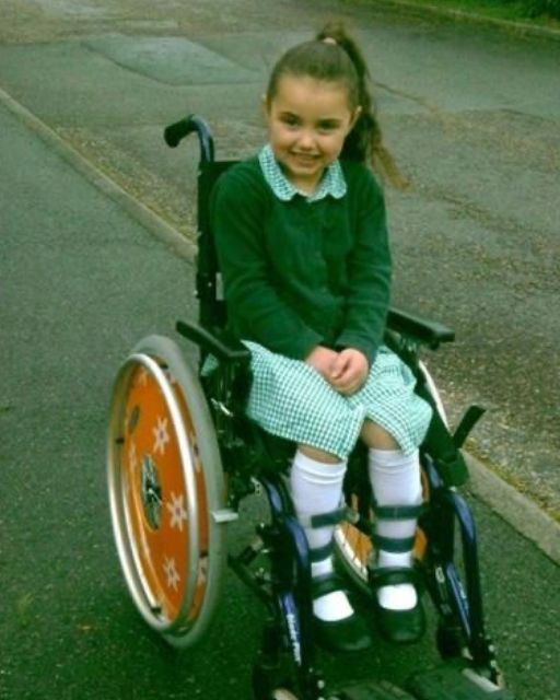 The girl in the wheel chair smiled at me and called my name before I could tell her.